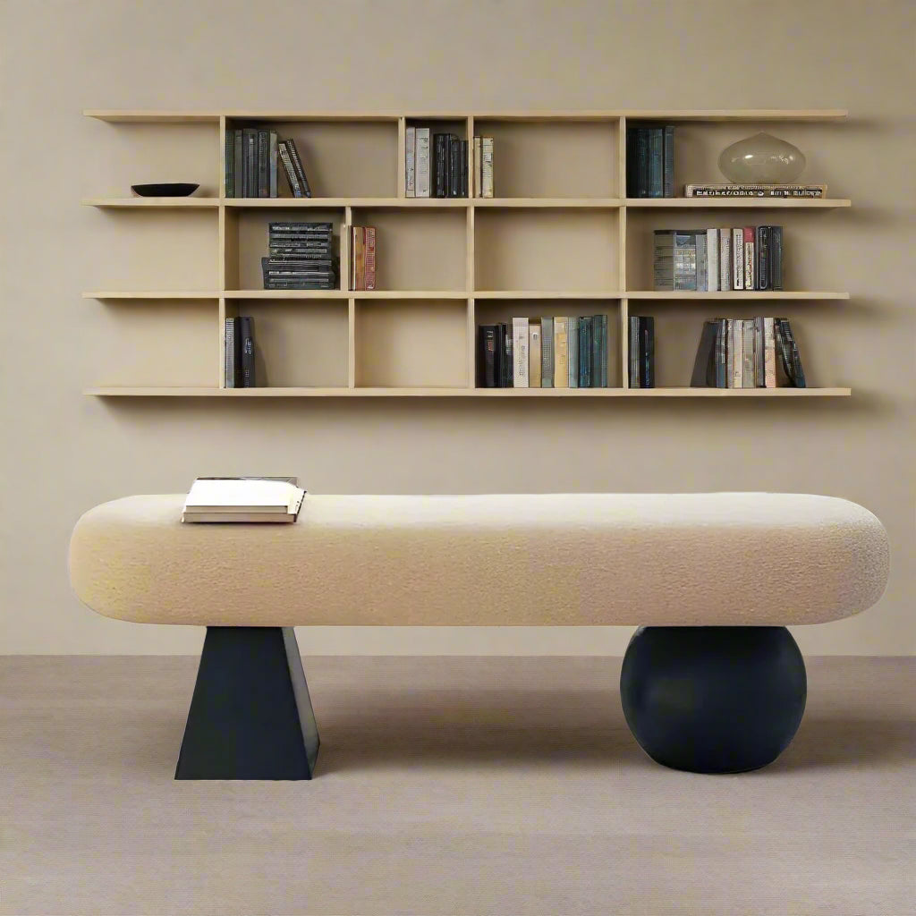 Modern living room with a bench, coffee table, and chair.