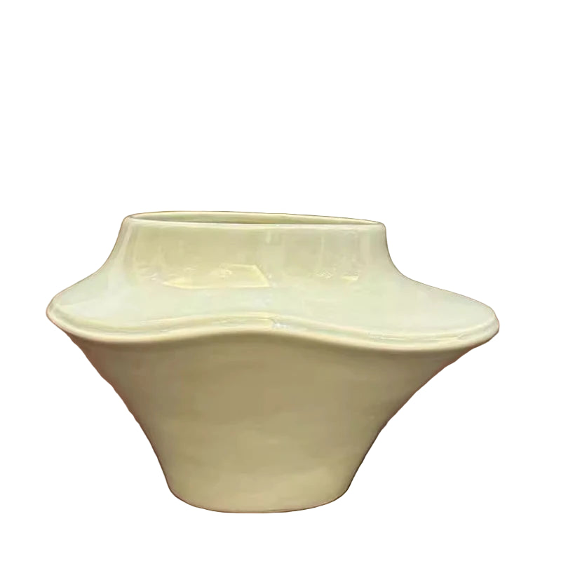 White ceramic bowl on a reflective surface with a blurred background
