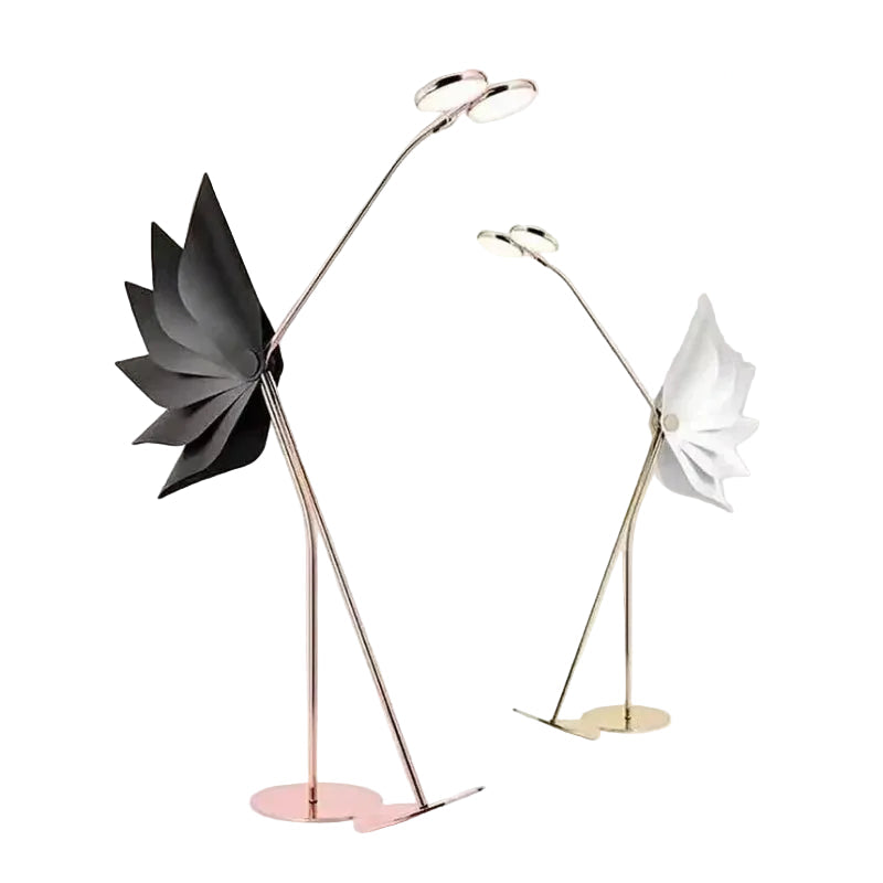 Two modern floor lamps with unique flamingo design on a white background