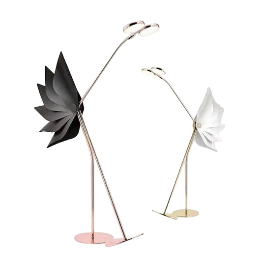 Two modern floor lamps with unique flamingo design on a white background
