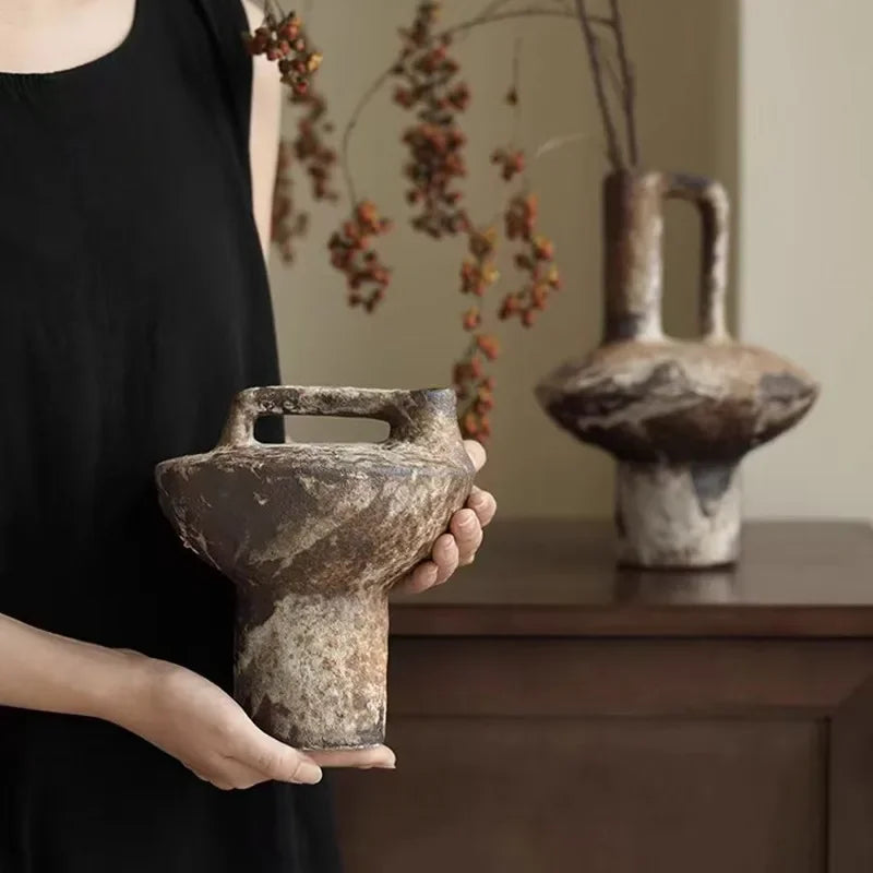 Person holding small wabi sabi vase.  Mottled finish