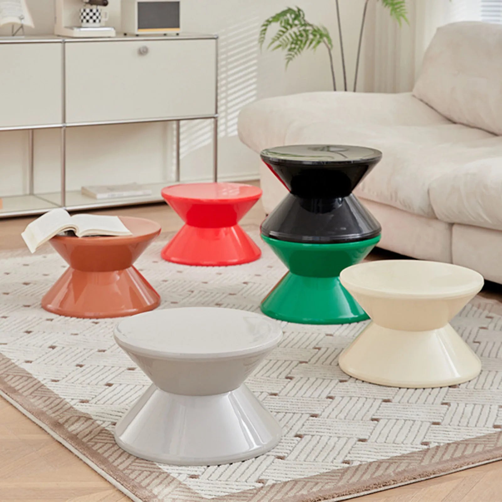 Colorful stools on a patterned rug in a living room setting
