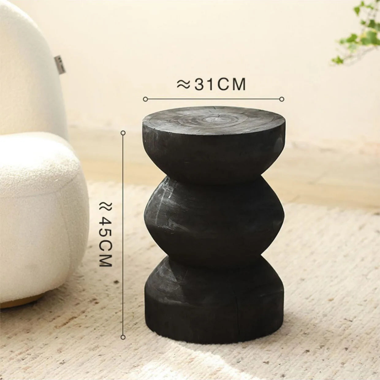 Black decorative stool with measurements on a neutral background
