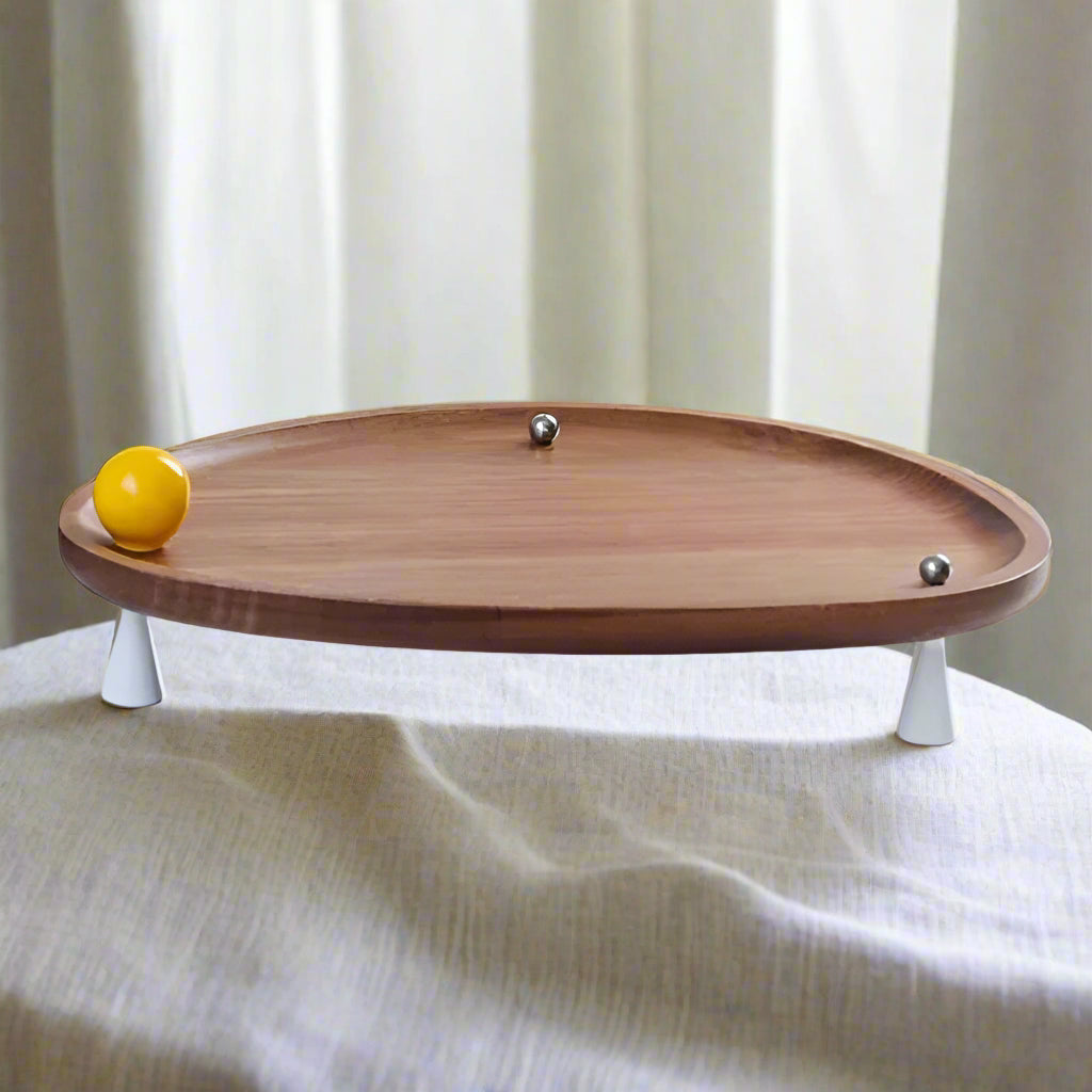 Two wooden trays with fruit on a white surface
