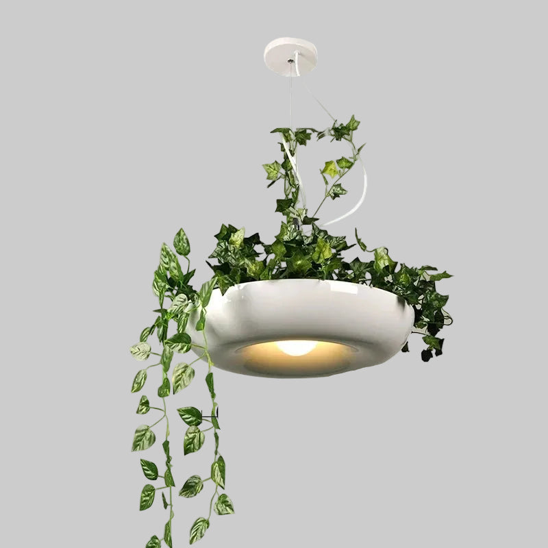 Decorative pendant light with green leaves and measurement details on a white background