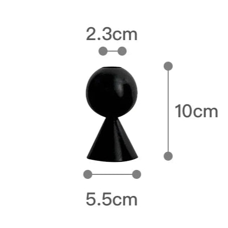 Black spherical object with measurements on a white background