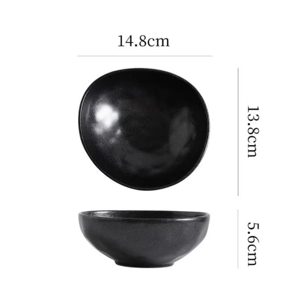Black ceramic bowl with measurements on a white background