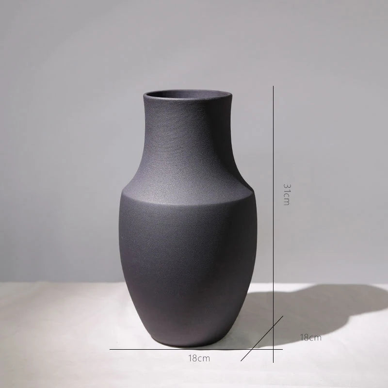 Gray vase on a light gray background with measurements indicated.