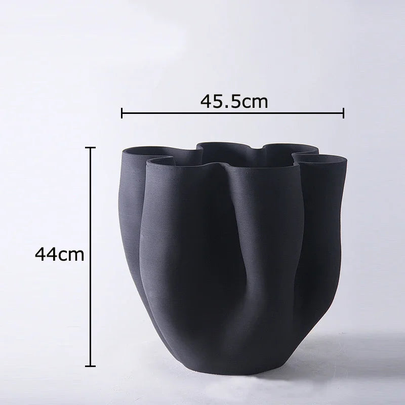 Black vase with measurements on a white background