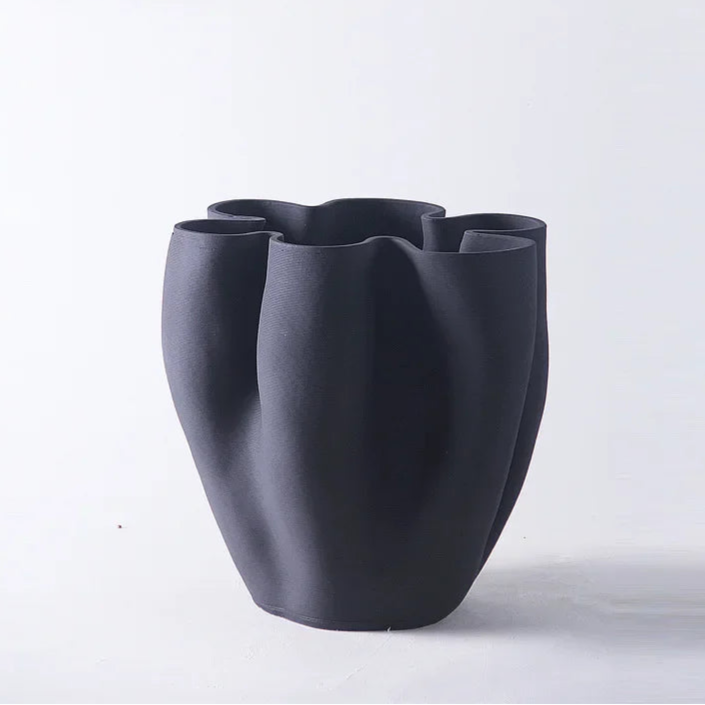 Black vase with a unique design on a white background, branded 'ZIZI Fish'.